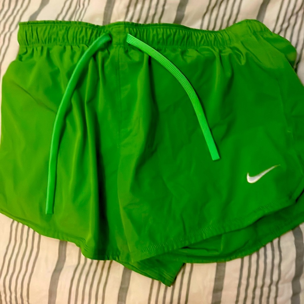 These are Nike shorts they are lime green and they are a size medium